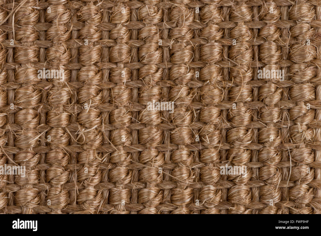 Closeup detail of a brown sisal carpet texture background Stock Photo