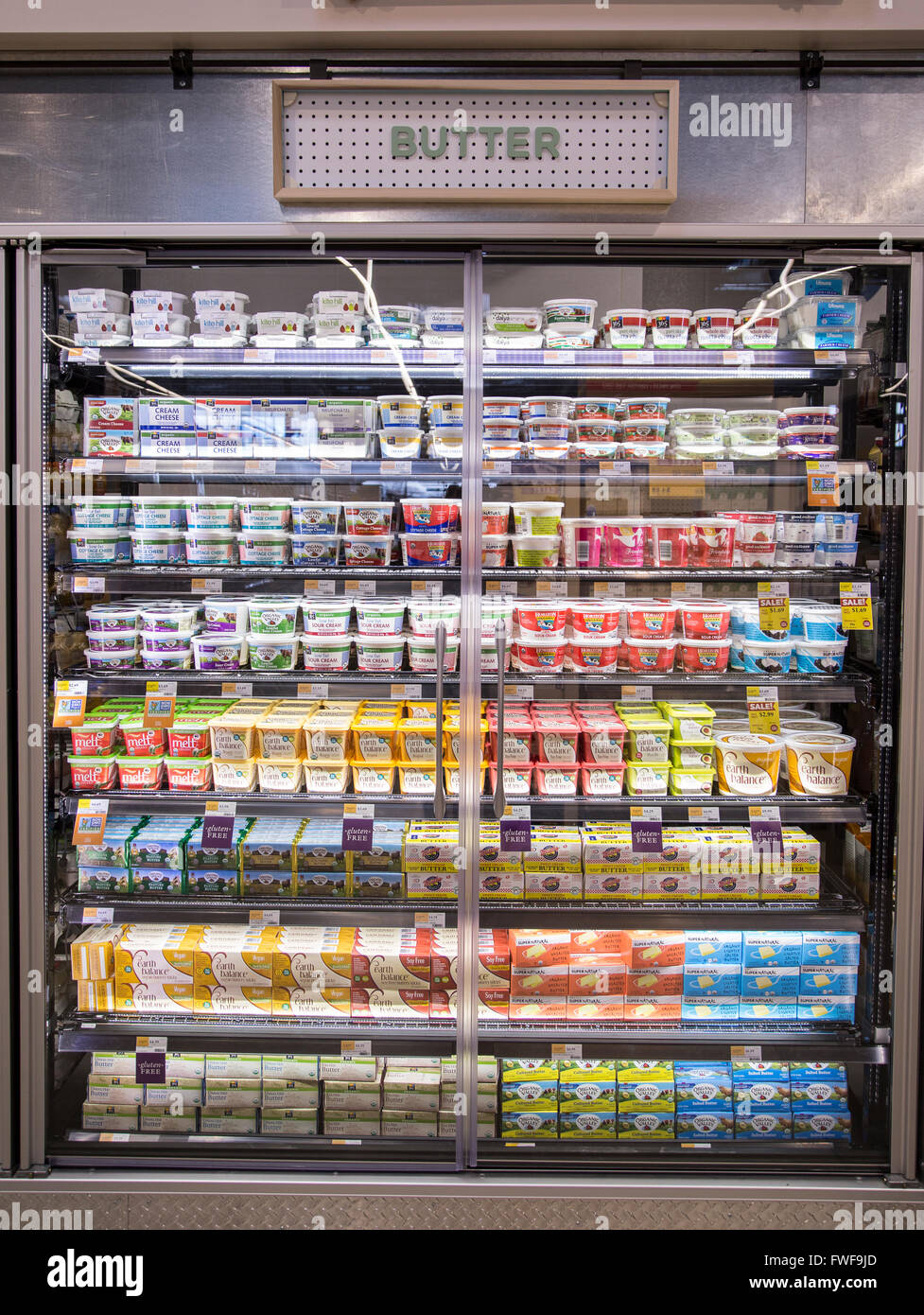 Butter displayed in a dairy refrigerator case at a grocery store Stock Photo