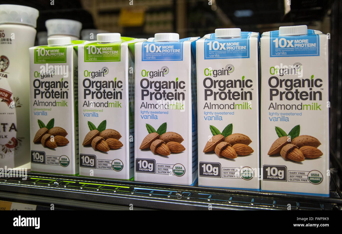 cartons of Orgain organic almond milk on a shelf in a grocery store Stock Photo
