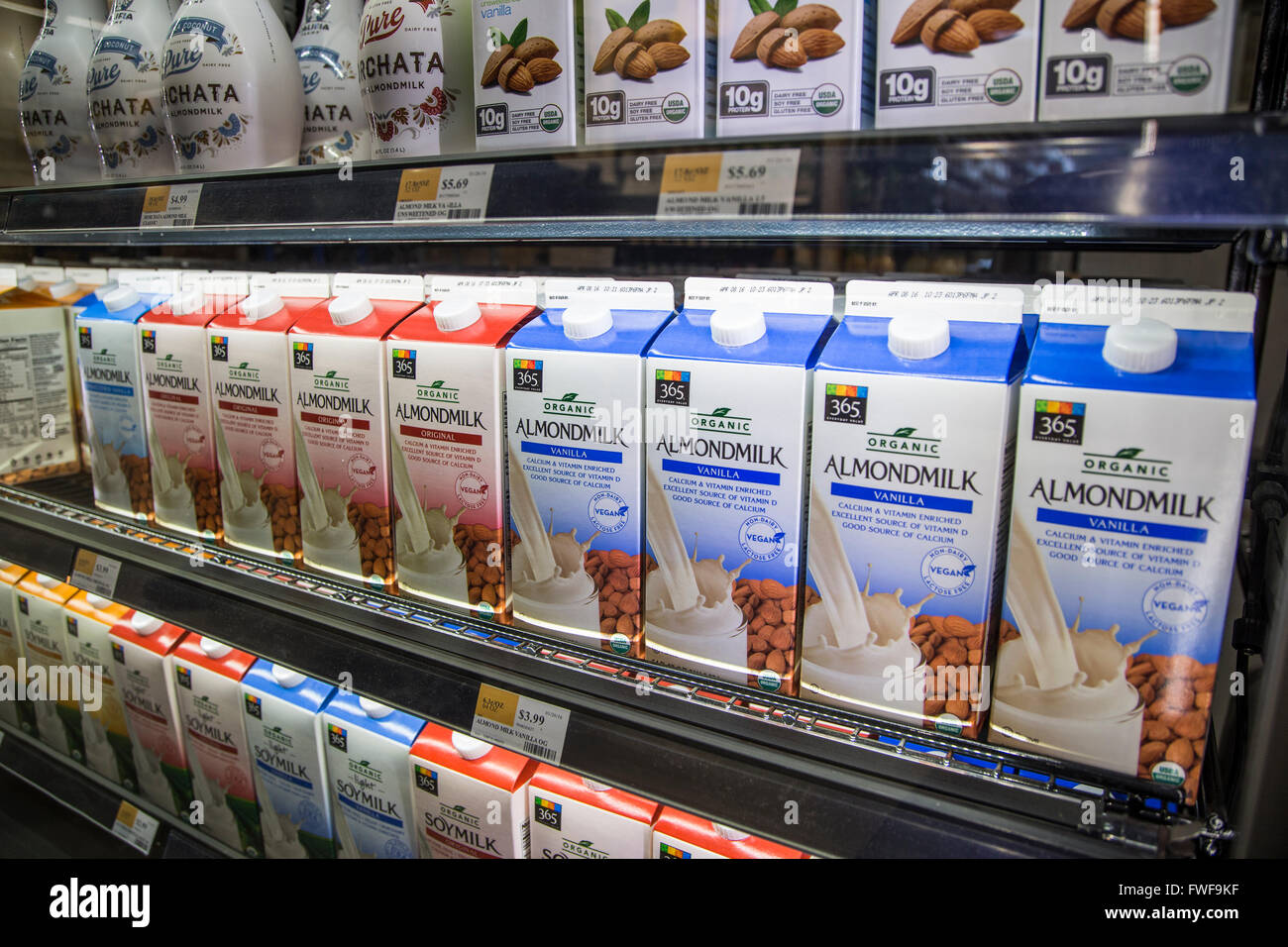 shelves of almond milk on a shelf at a grocery store Stock Photo