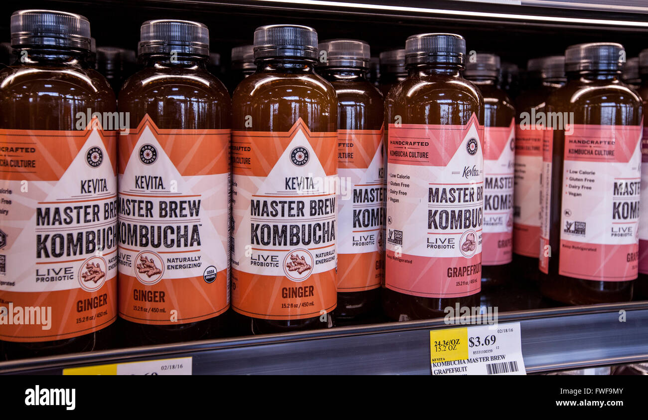 Bottles of kombucha tea on the shelf of a grocery store Stock Photo Alamy