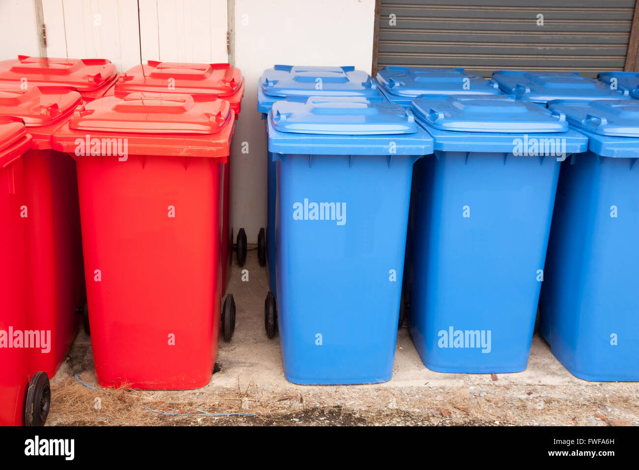 many bins row. blue and red bins Stock Photo Alamy