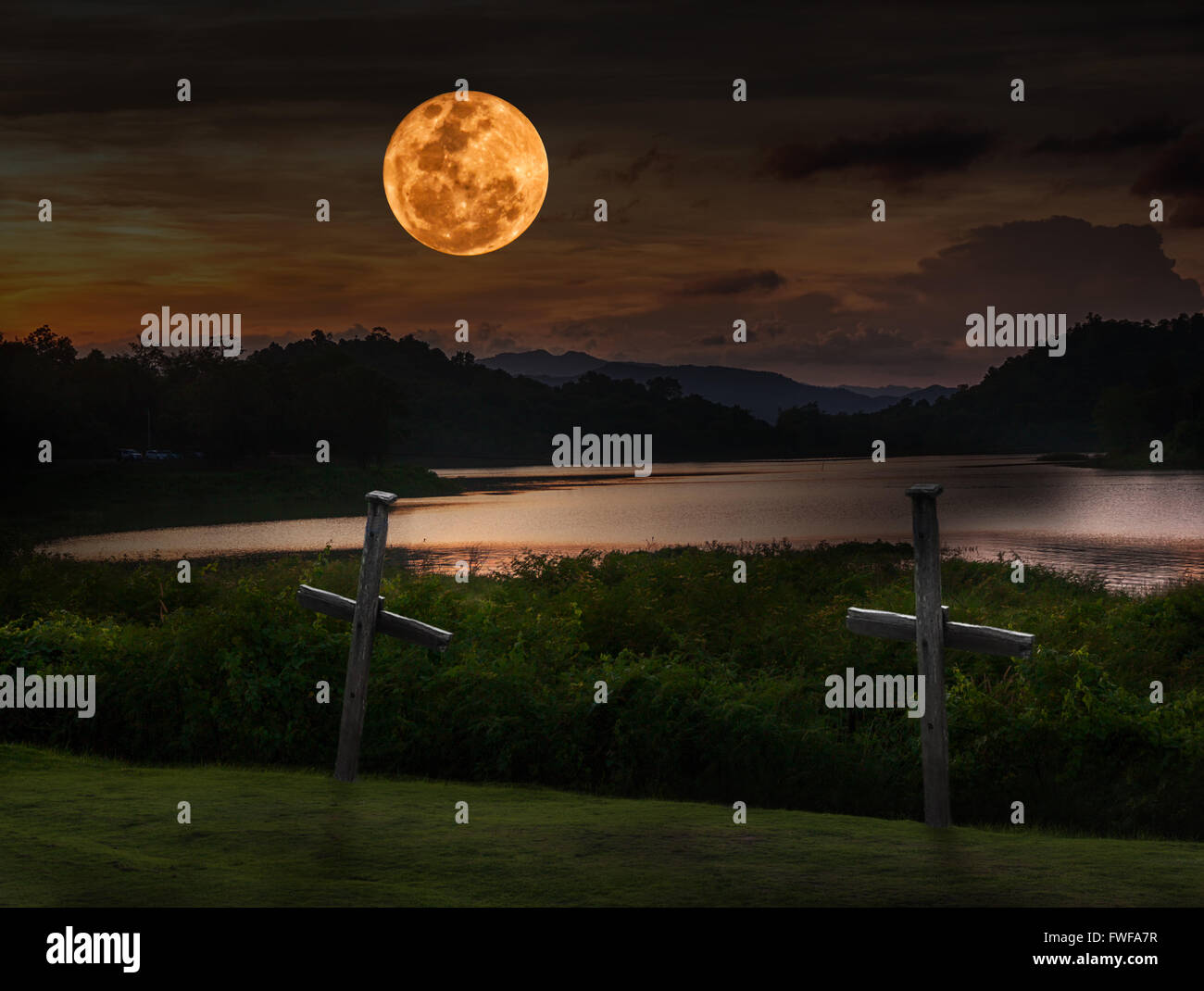 Full Moon In Dark Red Sky And Reflections In Water Background A Cross Stock Photo Alamy
