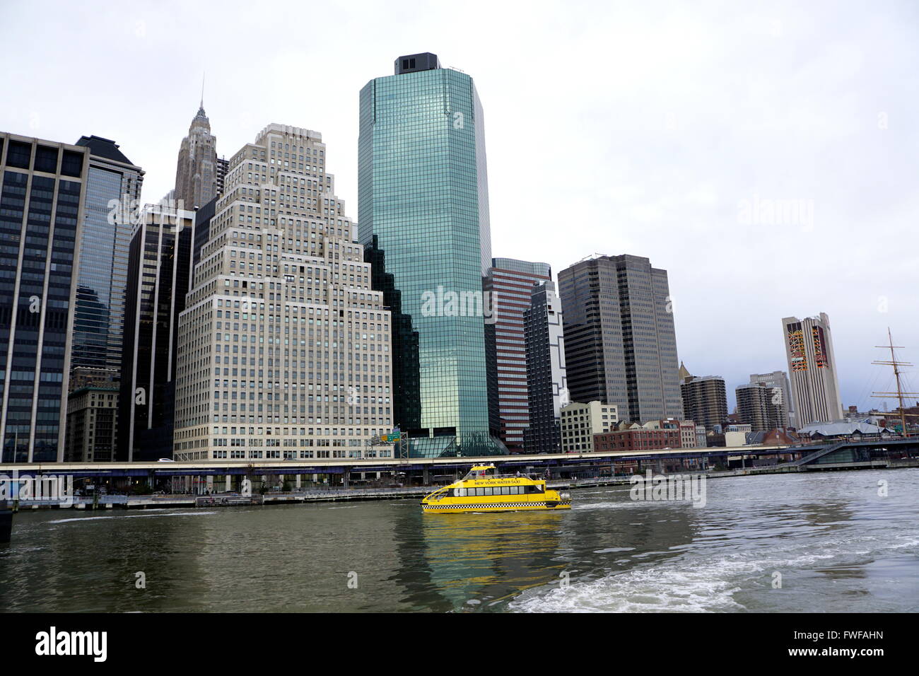 Water taxi at Pier 11 with the backdrop of Lower Manhattan skyscrapers