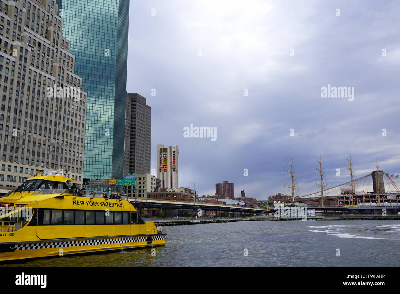 Water taxi at Pier 11 with the backdrop of Lower Manhattan skyscrapers