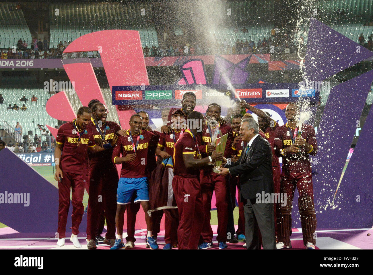 West indies team celebrate their World T20 win, women team member also join this celebration during ICC World T20 final match. West Indies beat England by four wickets in ICC T20 final at Eden Gardens, Kolkata. England batted first and scored 155 for 9 wickets by the help of Roots half century. Chasing the target West Indies win the game two delivers to left and four wickets in hand. Samuel score magnificent 85 and Brathwaite scored not out 34. Samuel grabs the player of the match award and India's Virat Kohli get player of player of the tournaments. (Photo by Saikat Paul/Pacific Press) Stock Photo