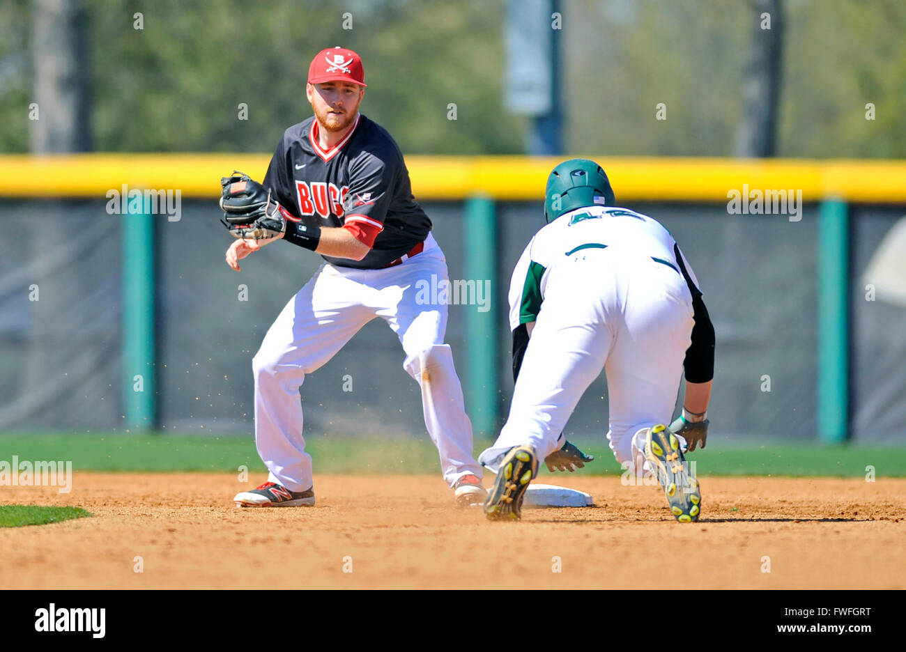 Cleveland, MS, USA. 03rd Apr, 2016. Christian Brothers second baseman Lucas Castleberry (left) looks to tag out a Delta State runner during the sixth inning of an NCAA college baseball game between Christian Brothers and Delta State at Dave ''Boo'' Ferriss Field in Cleveland, MS. Delta State won 10-0 after 7 innings. Austin McAfee/CSM/Alamy Live News Stock Photo