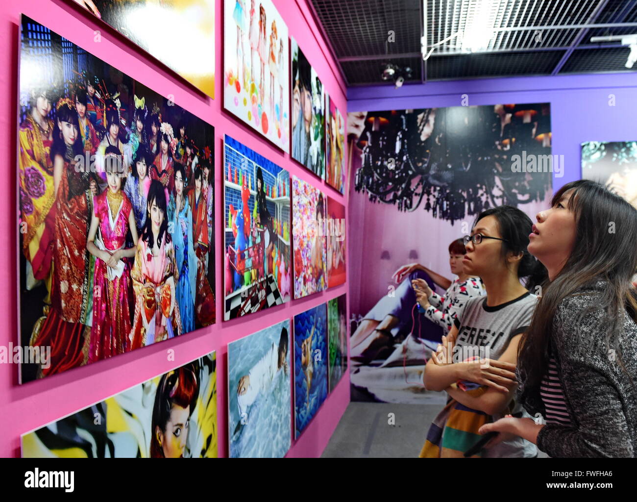 Taipei's Taiwan. 5th Apr, 2016. Visitors watch photo creations of Japanese artist Mika Ninagawa in the Museum of Contemporary Art, in Taipei, southeast China's Taiwan, April 5, 2016. This is the largest solo exhibition since the artist's debut, showing her creations in past 20 years. Credit:  Zhang Guojun/Xinhua/Alamy Live News Stock Photo