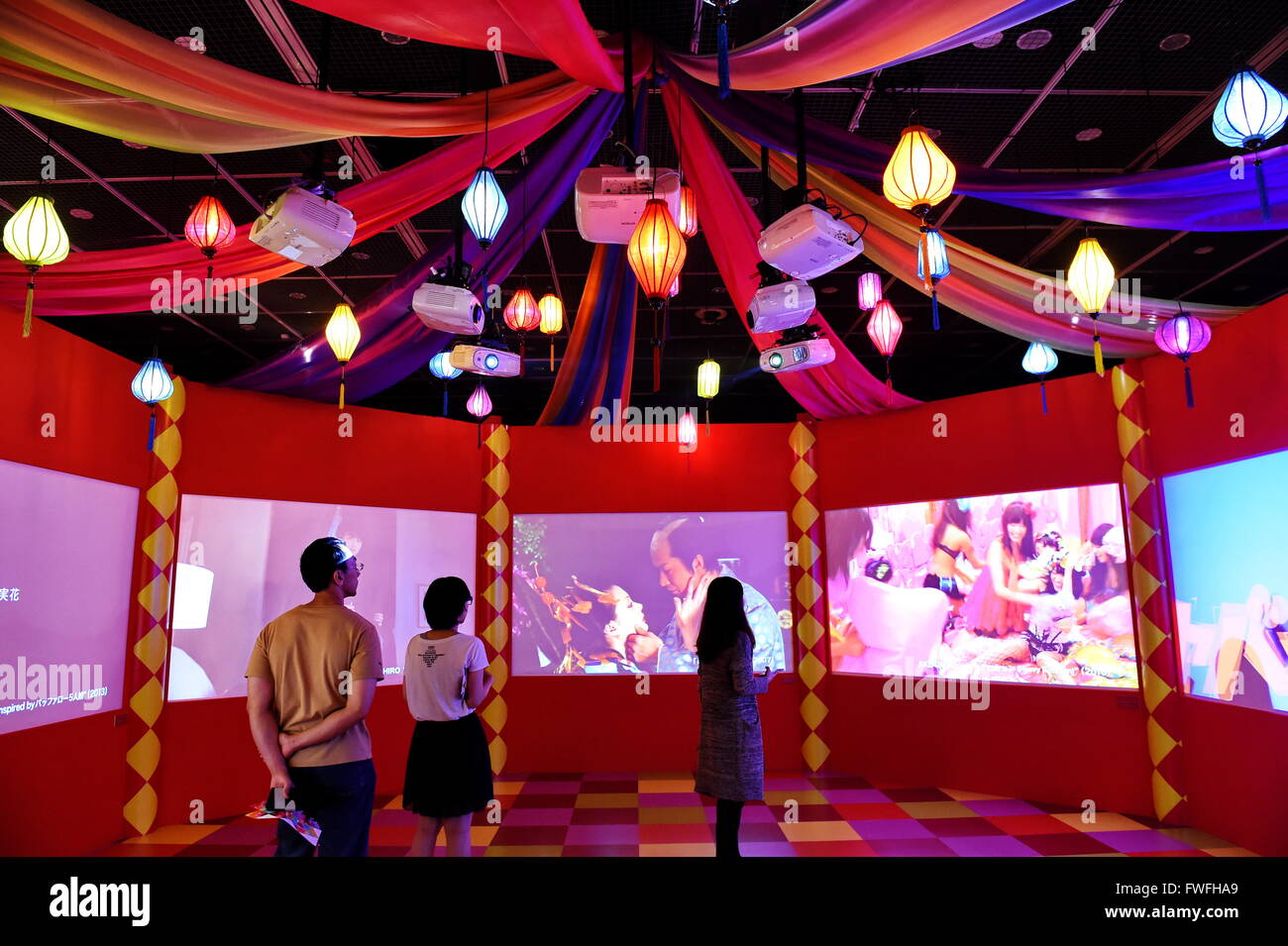 Taipei's Taiwan. 5th Apr, 2016. Visitors watch video creations of Japanese artist Mika Ninagawa in the Museum of Contemporary Art, in Taipei, southeast China's Taiwan, April 5, 2016. This is the largest solo exhibition since the artist's debut, showing her creations in past 20 years. Credit:  Zhang Guojun/Xinhua/Alamy Live News Stock Photo