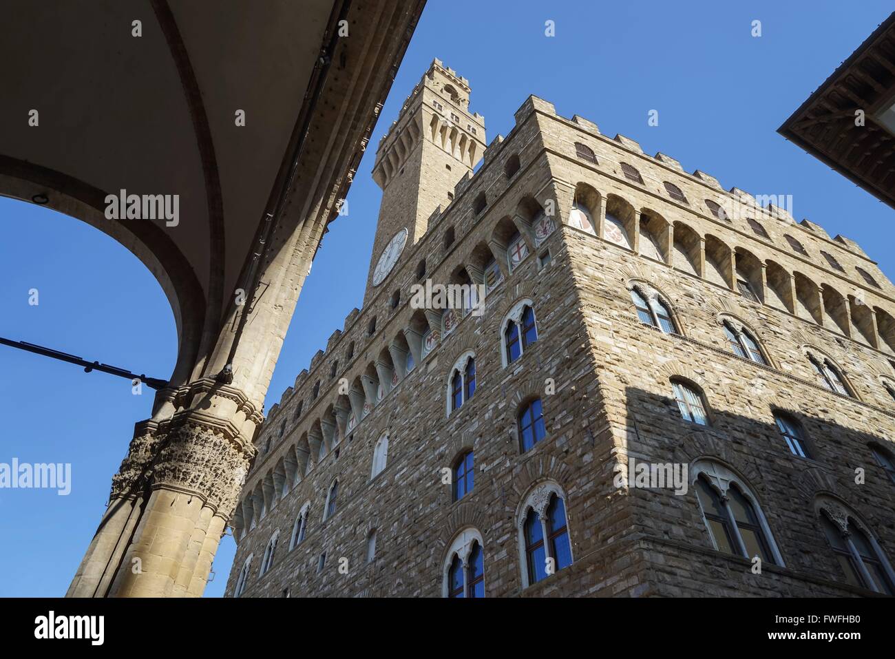 Italy: Palazzo Vecchio (town hall) as seen from Loggia dei Lanzi in Florence. Photo from 20. February 2016. Stock Photo