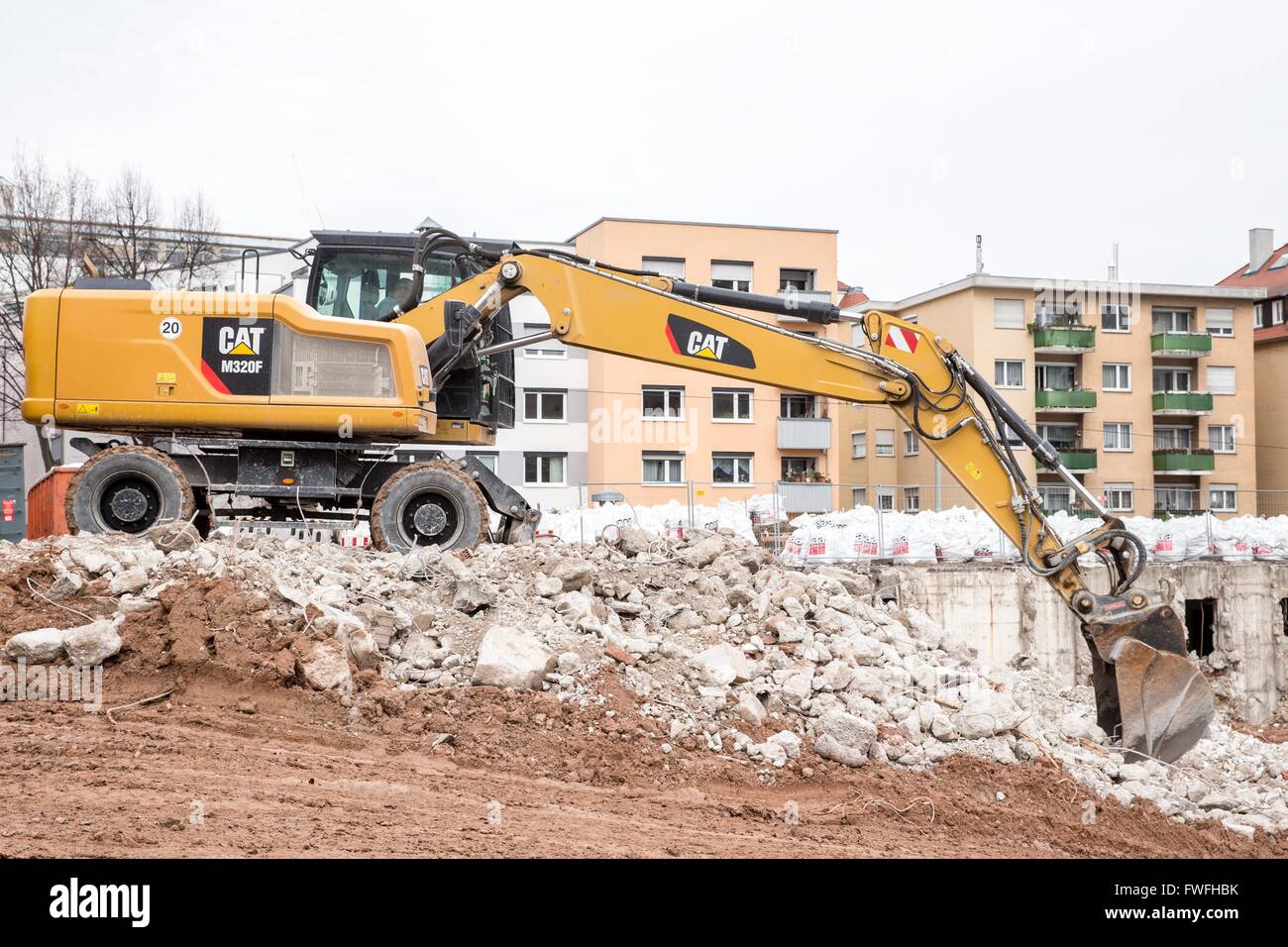 Brand new Caterpillar M320F mobil excavator demolish a former children