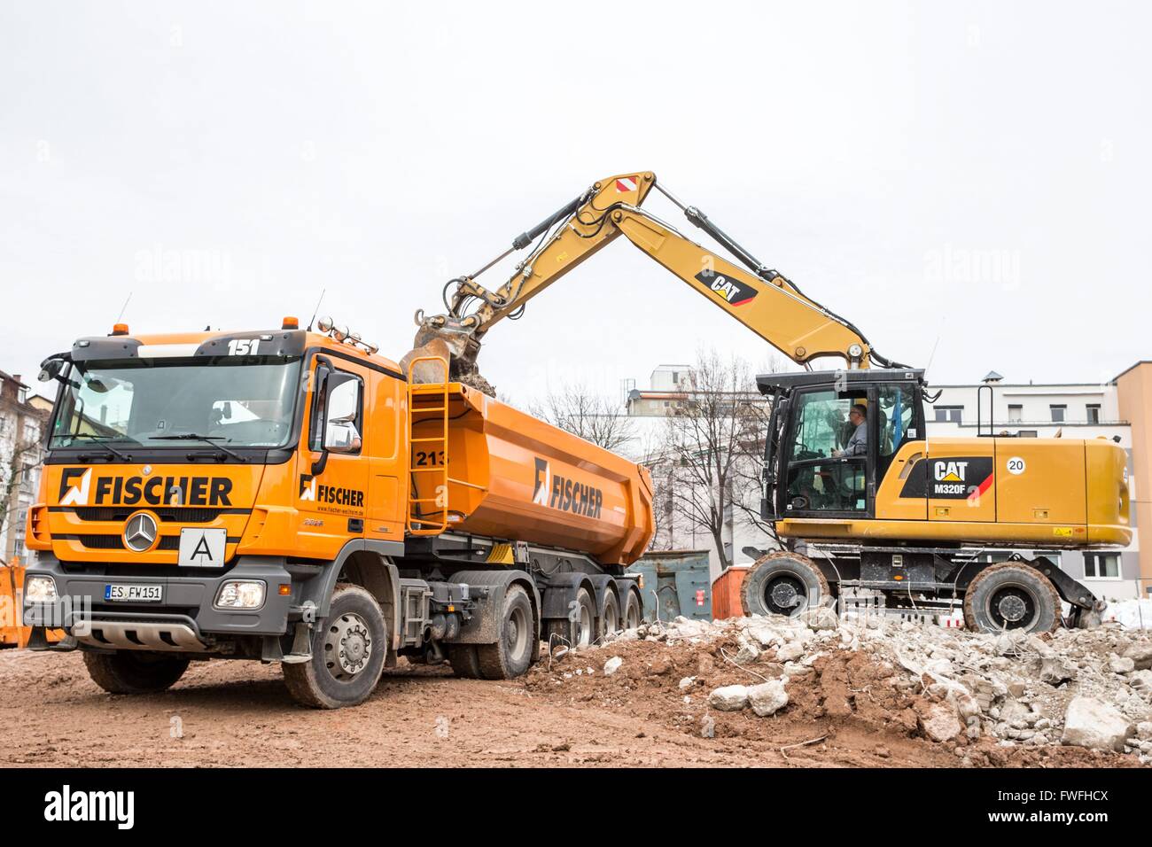 Brand new Caterpillar M320F mobil excavator demolish a former children hospital, Stuttgart, Germany, Mrch. 4, 2016. Stock Photo