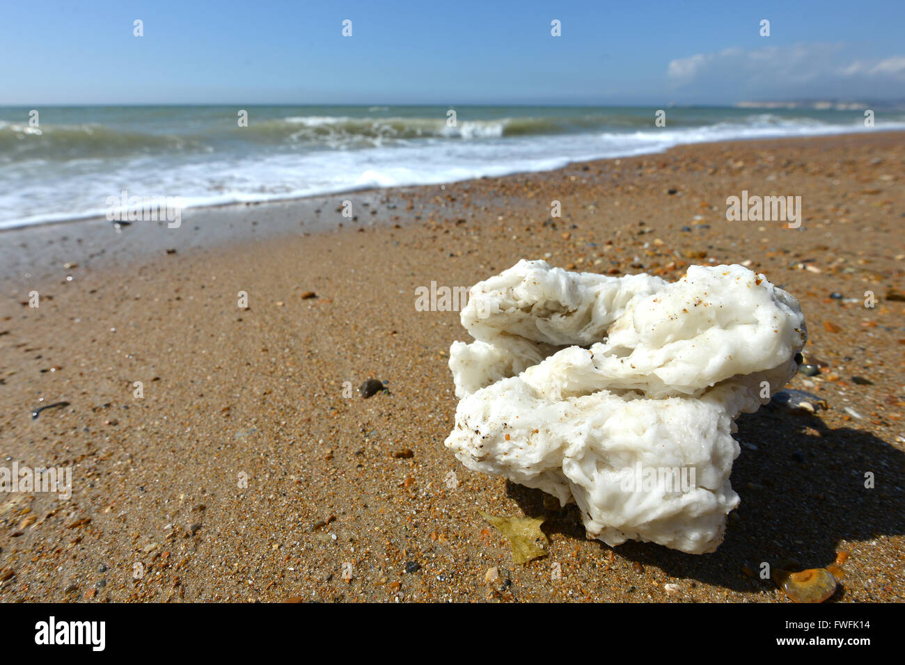 Palm oil of 'fatbergs' washed up on UK beach. Seaford, UK Stock Photo