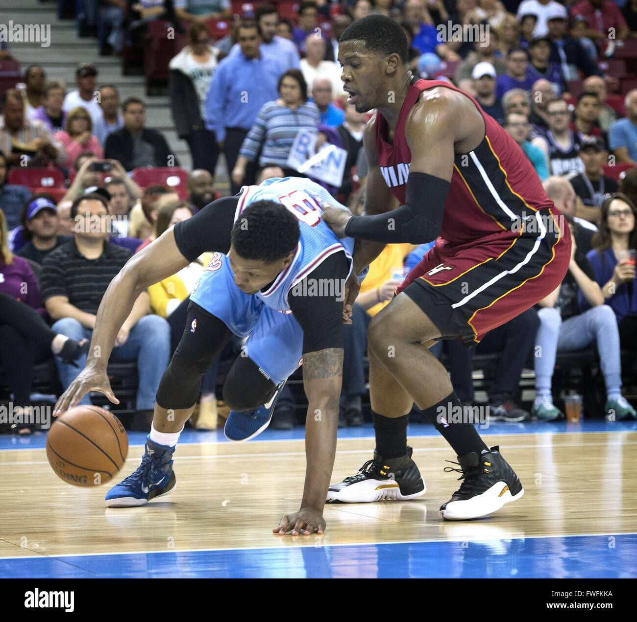 Sacramento, CA, USA. 1st Apr, 2016. Sacramento Kings forward Rudy Gay (8) loses his balance but keeps possession on this drive in first quarter action. Miami Heat forward Joe Johnson (2) defends. Sacramento Kings against the Miami Heat on Friday, April1, 2016 at Sleep Train Arena in Sacrament, Calif. © Hector Amezcua/Sacramento Bee/ZUMA Wire/Alamy Live News Stock Photo