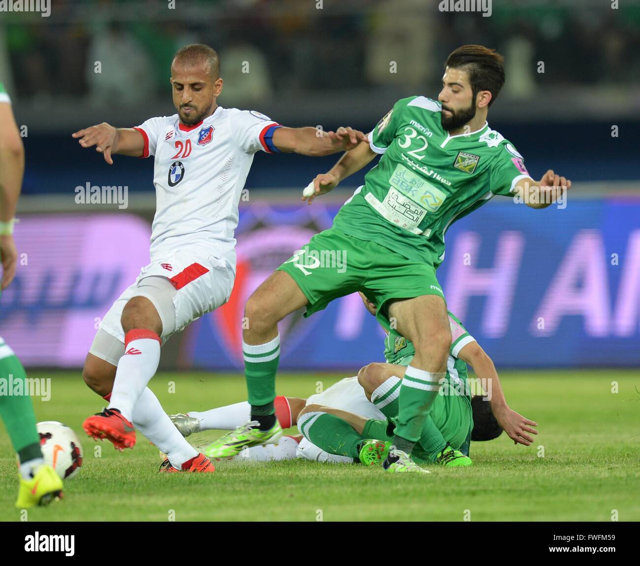 Kuwait City. 5th Apr, 2016. Hussain Hakim (L) of Al Kuwait SC vies with