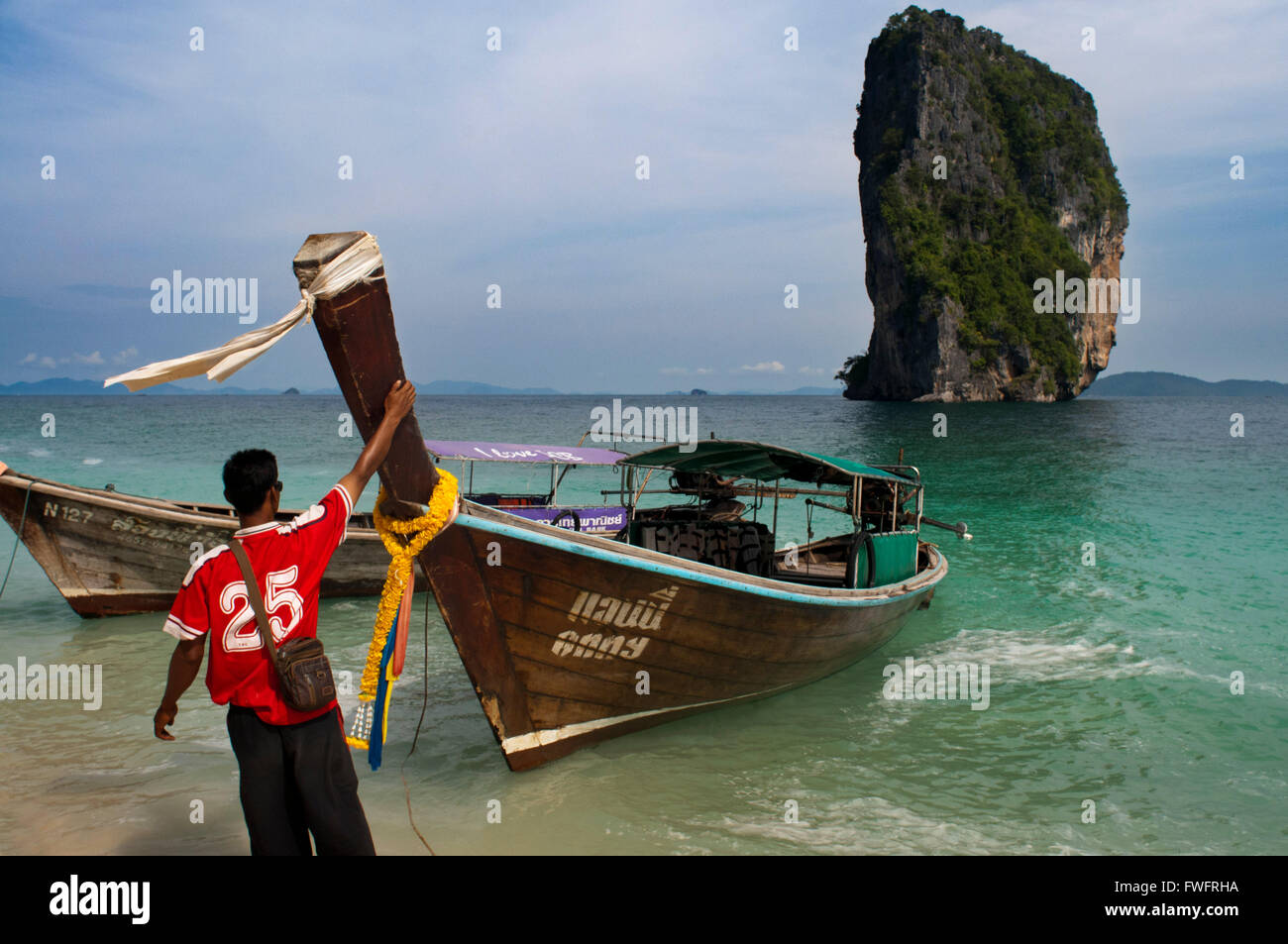 Long-tail boat moored on the beach at Koh Poda Islands in the Andaman Sea, Thailand. Ko Poda is an island off the west coast of Stock Photo
