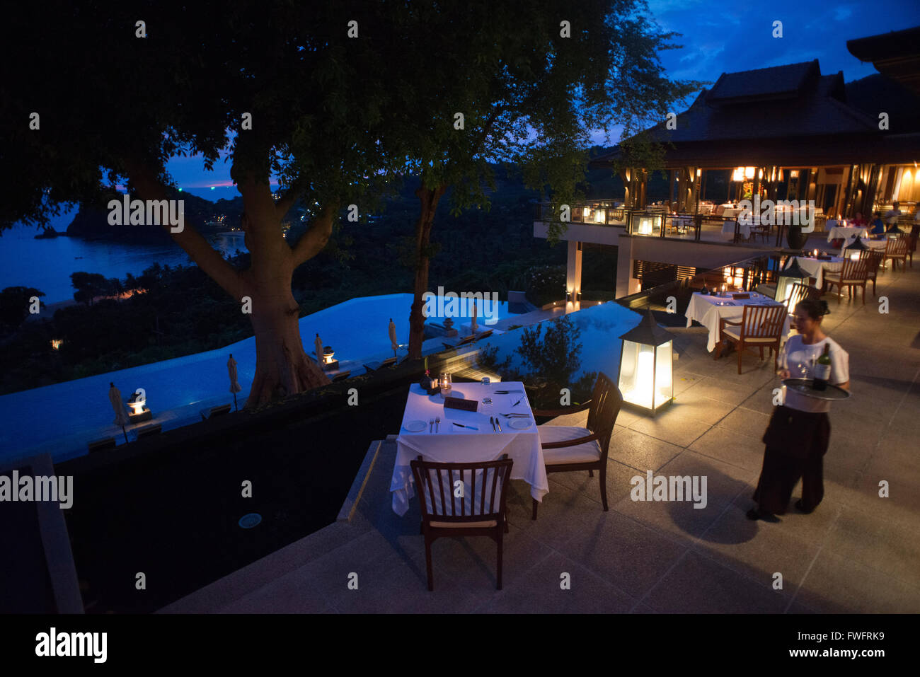 Sunset. Restaurant in fornt of the pool at the luxury hotel Pimalai Resort, Kantiang Beach, Ko Lanta or Koh Lanta island, Krabi, Stock Photo