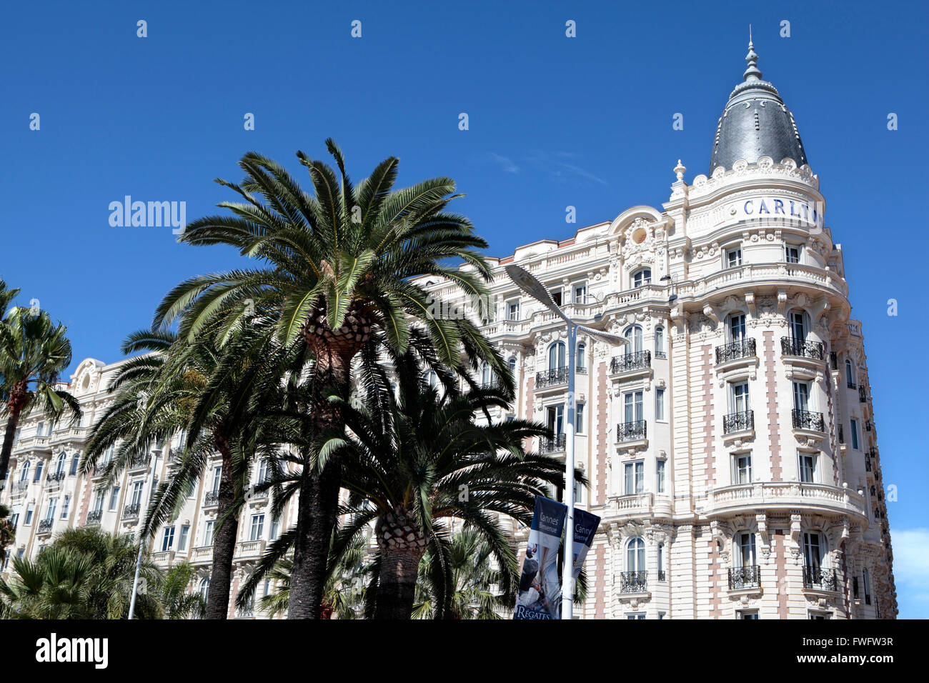 Corner view of the facade and dome of the famous Carlton International Hotel situated on the croisette boulevard in Cannes, Fran Stock Photo