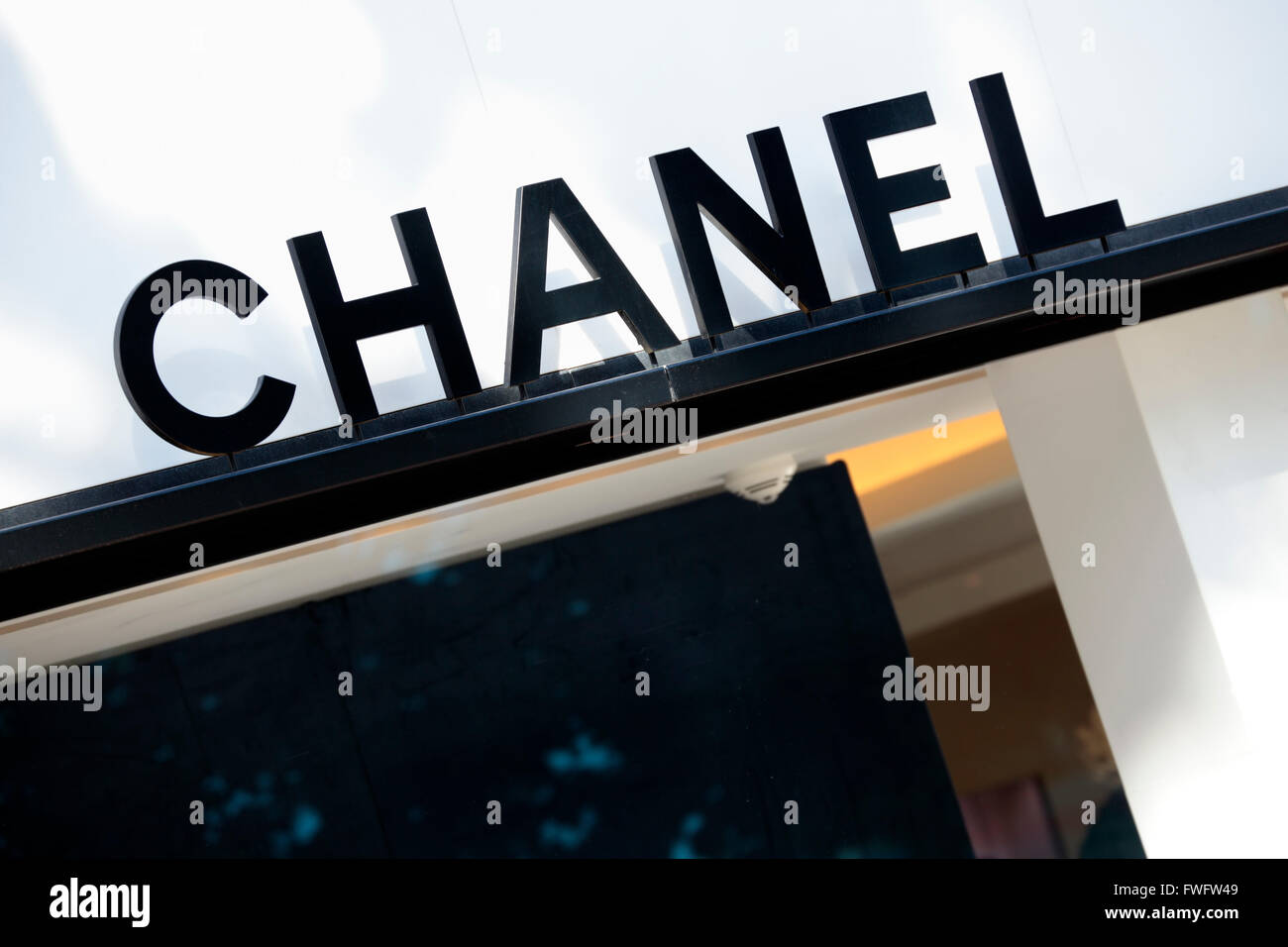 Chanel sign and shop front with part of window display. Stock Photo