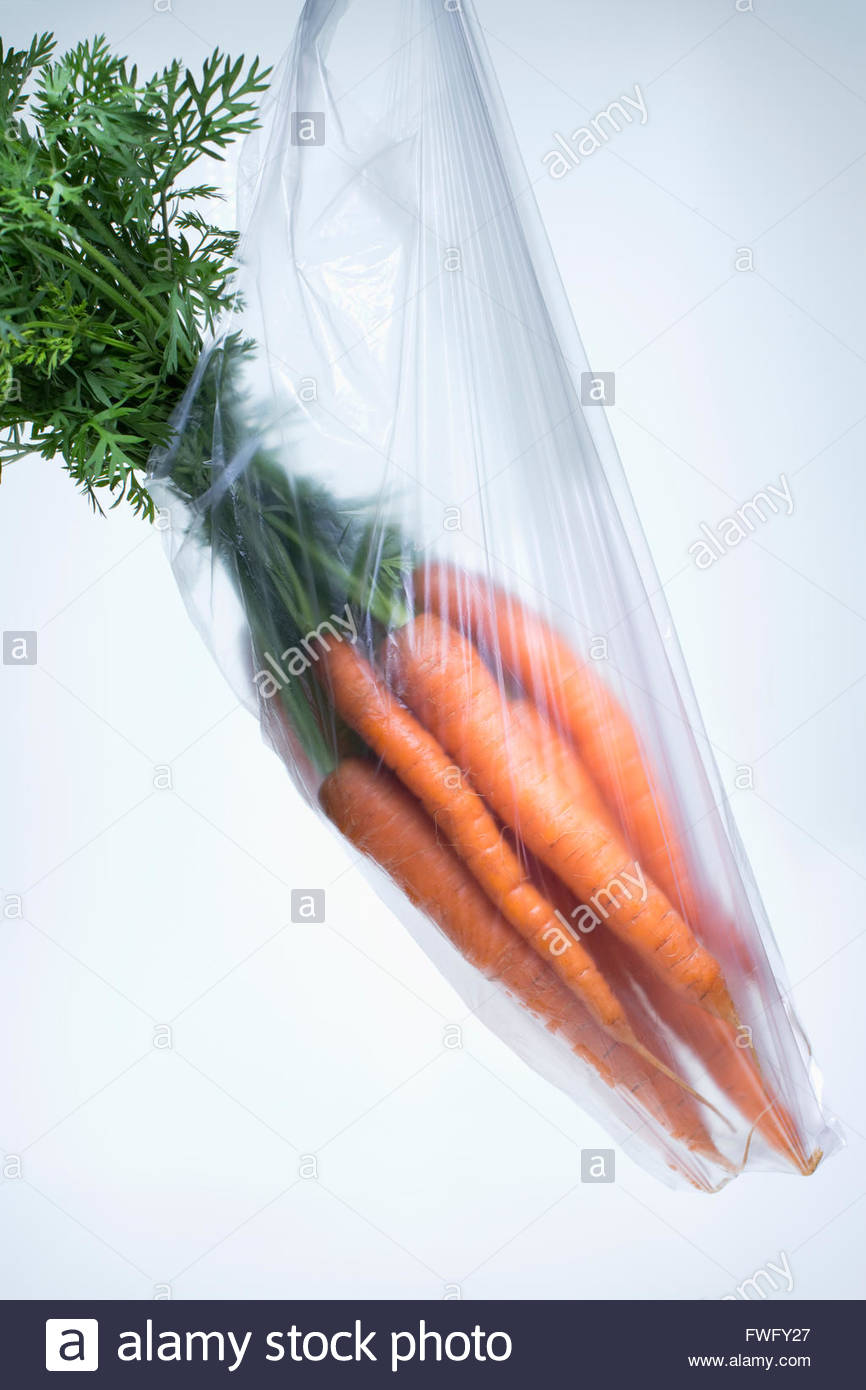 Download Fresh Carrots In Plastic Bag Over White Background Stock Photo Alamy PSD Mockup Templates