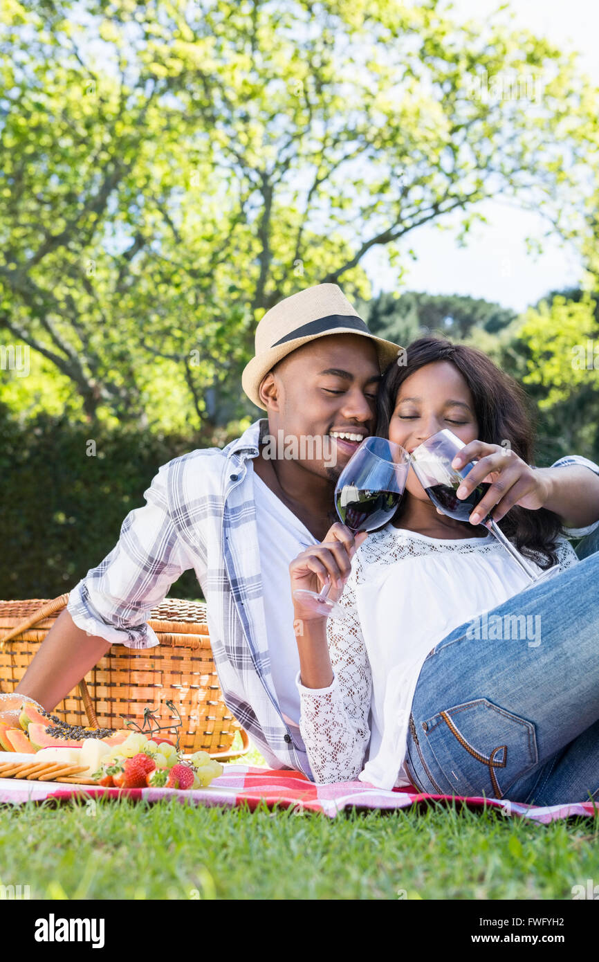 Young couple having a picnic in the park Stock Photo - Alamy