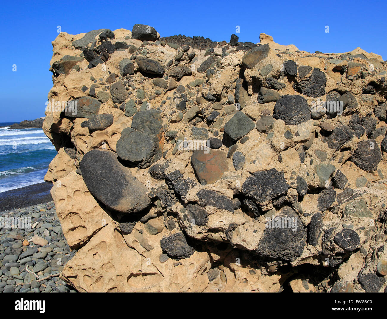 Conglomerate rock with volcanic bombs embedded in sediment, Playa de Garcey, Fuerteventura, Canary Islands, Spain Stock Photo