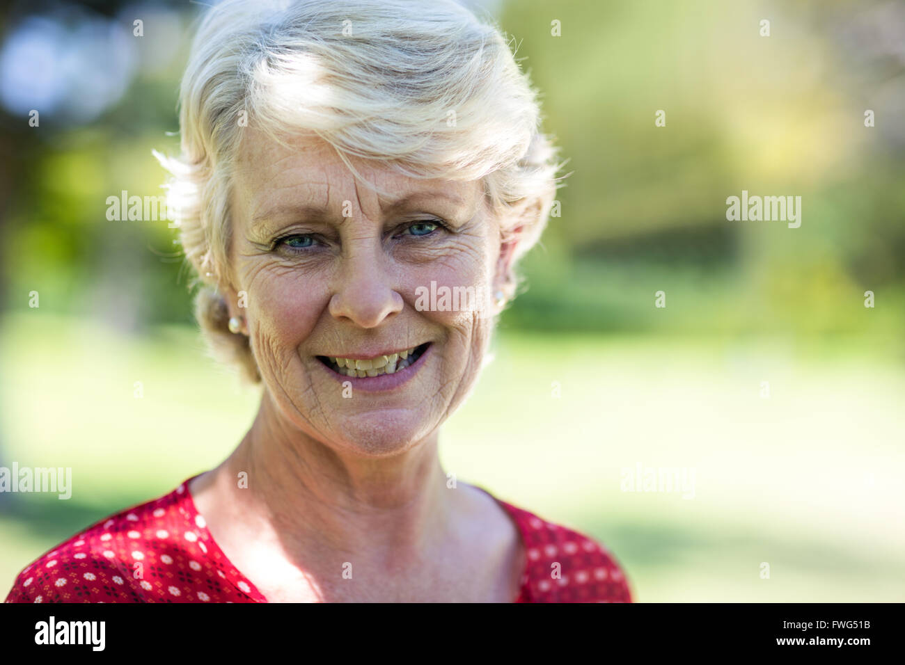 Portrait of smiling senior woman Stock Photo - Alamy