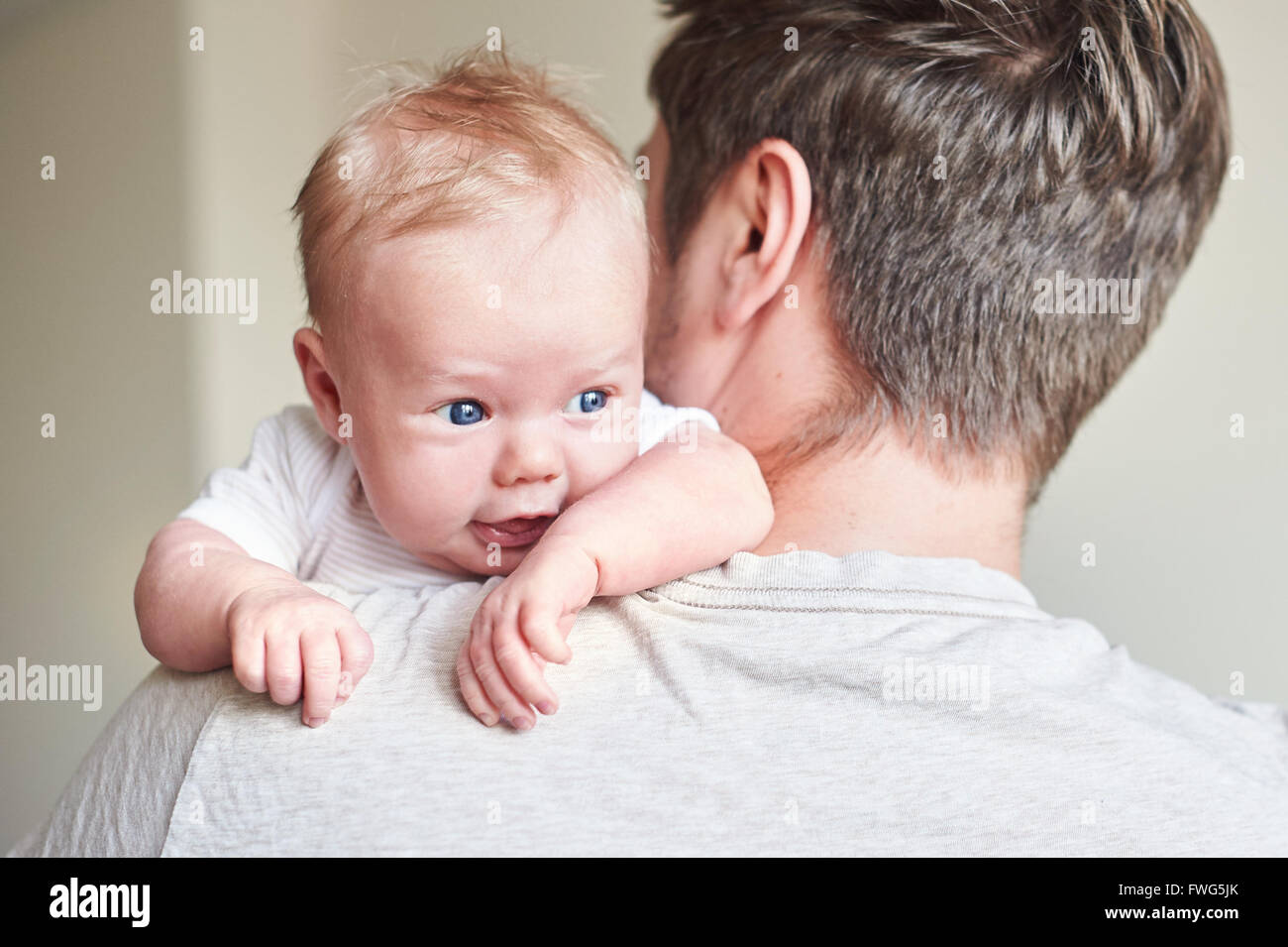 Happy father holding newborn baby in his arms Stock Photo