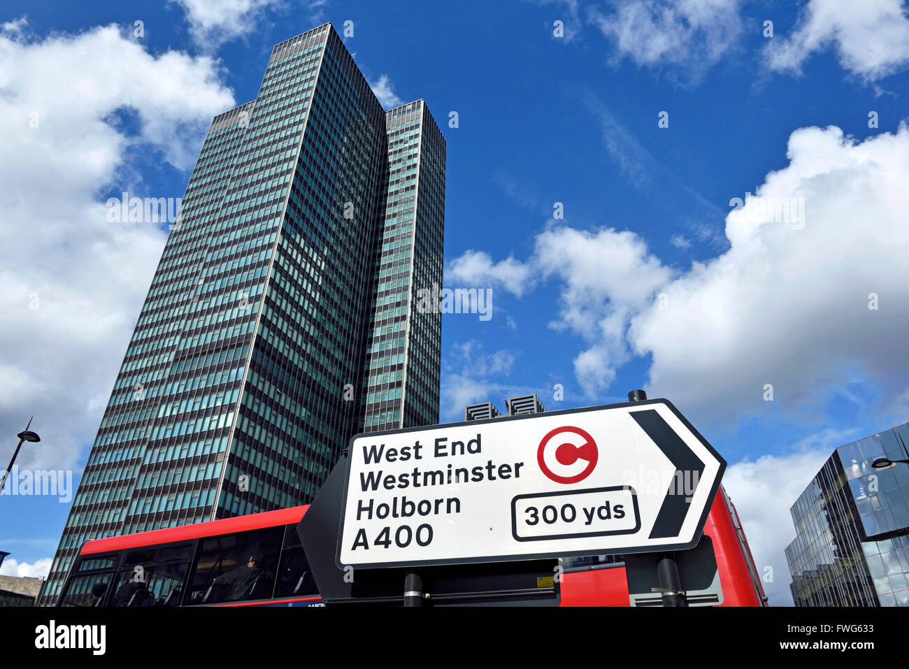 Traffic direction sign with congestion charge symbol, EustonTower in