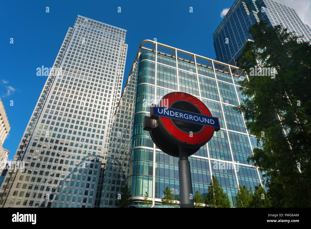 Skyscrapers and London Underground sign at Canary Wharf, Docklands the heart of the financial district of London Stock Photo