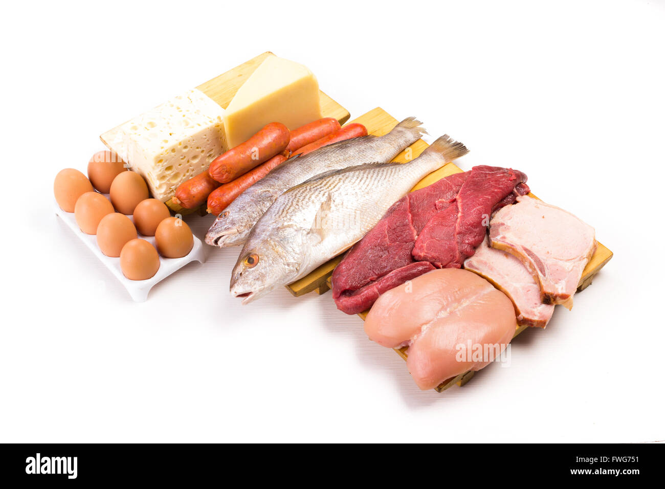 Group of important proteins, meats, fish, dairy, eggs, white meat on a white background, Shot from above Stock Photo