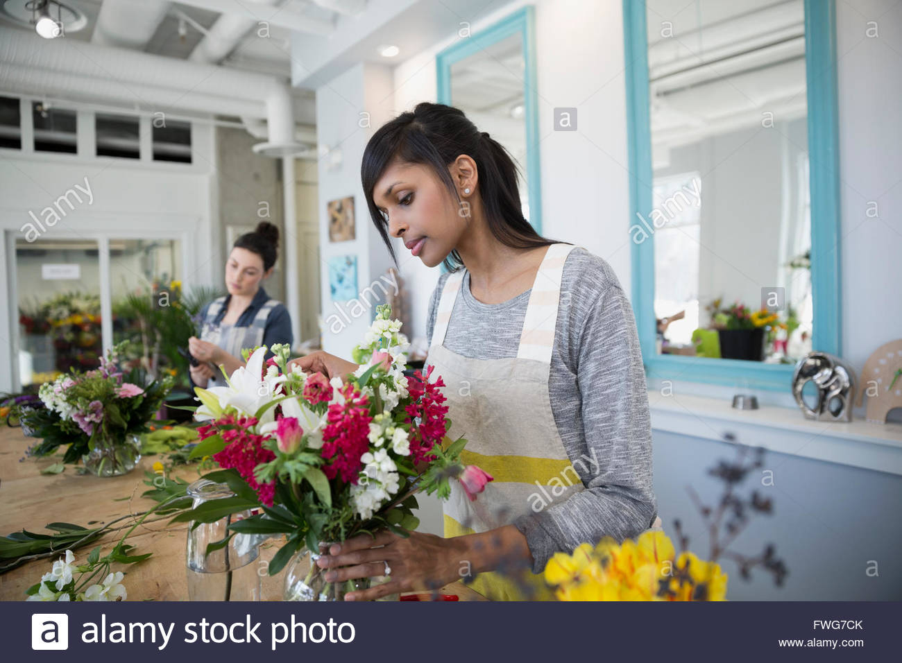 Florist arranging flower bouquet in flower shop Stock Photo Alamy