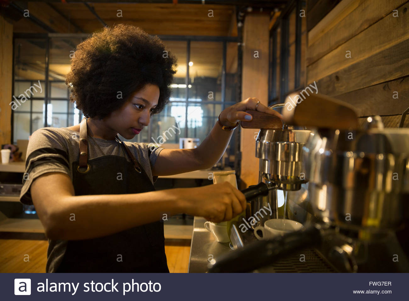 Barista using espresso machine in coffee shop Stock Photo Alamy