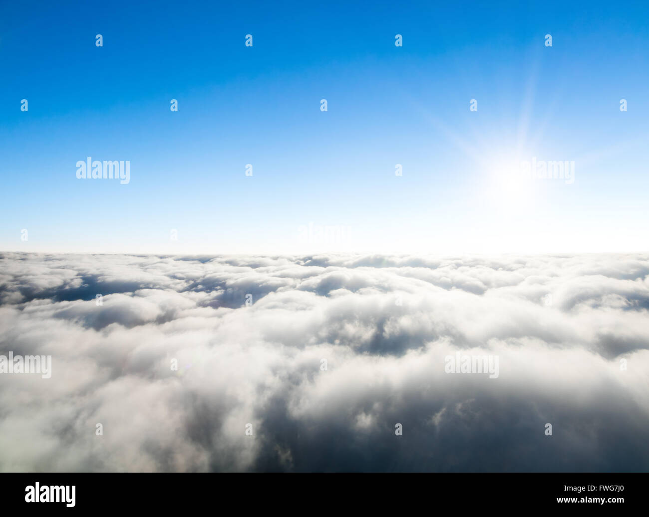Beautiful view above clouds from airplane perspective Stock Photo