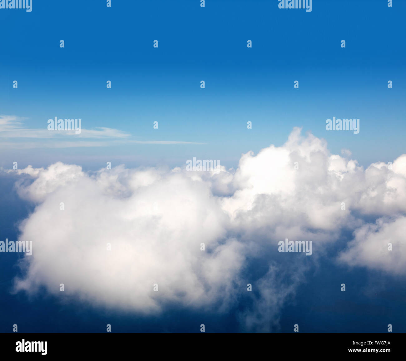 Beautiful view above clouds from airplane perspective Stock Photo