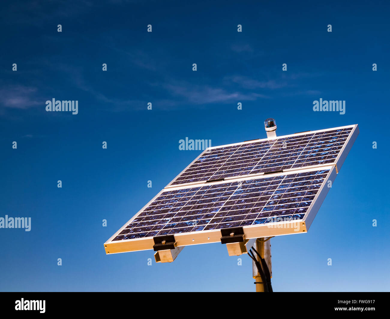Photovoltaic cells against a blue sky. Stock Photo