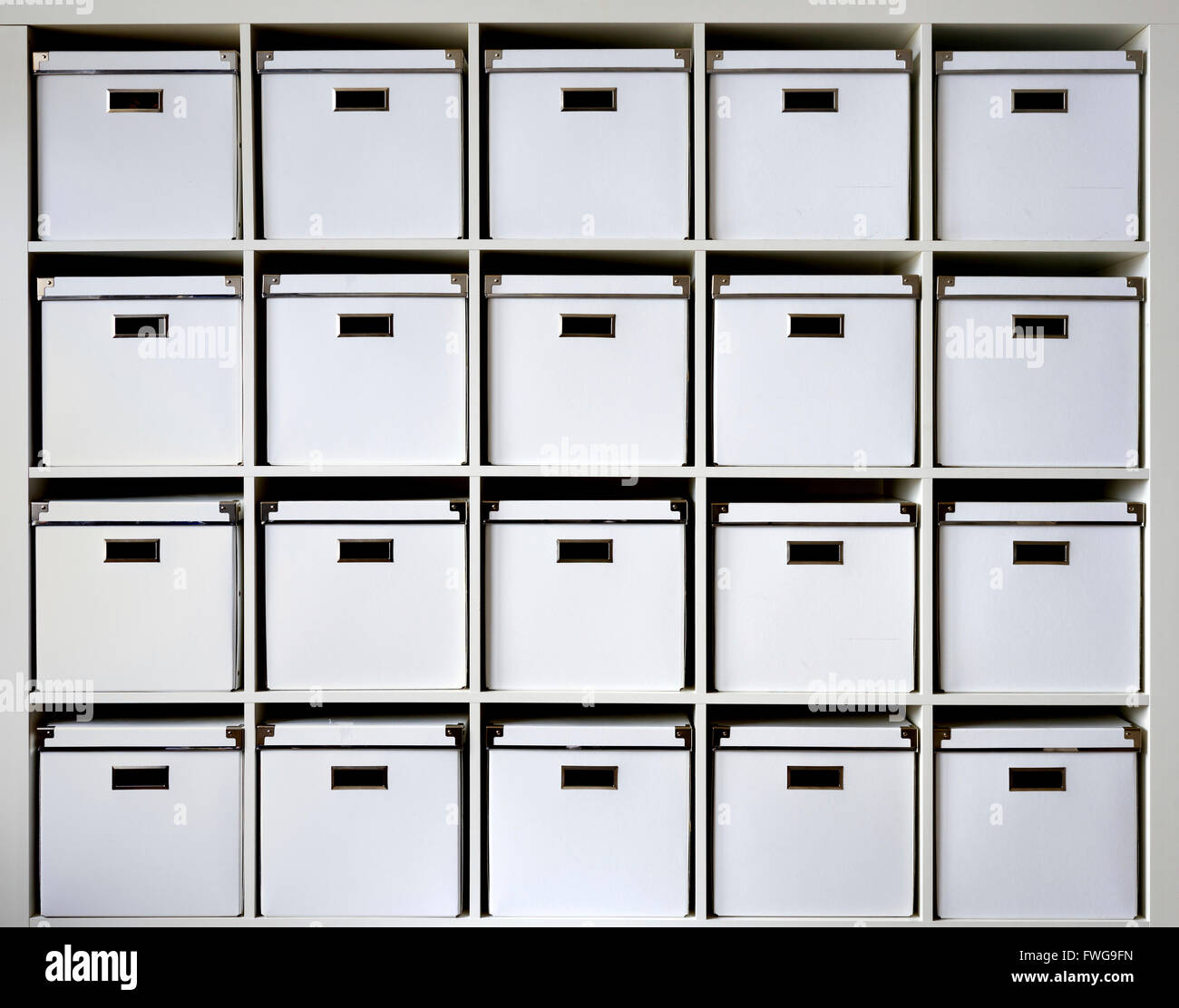 Storage boxes on shelves. Stock Photo