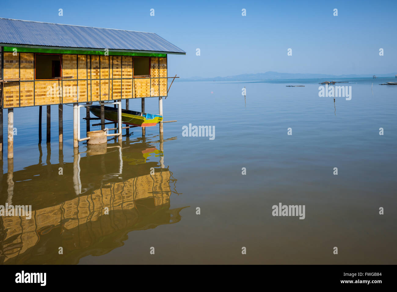 Traditional built stilt building on the sea shore, northern Sabah in
