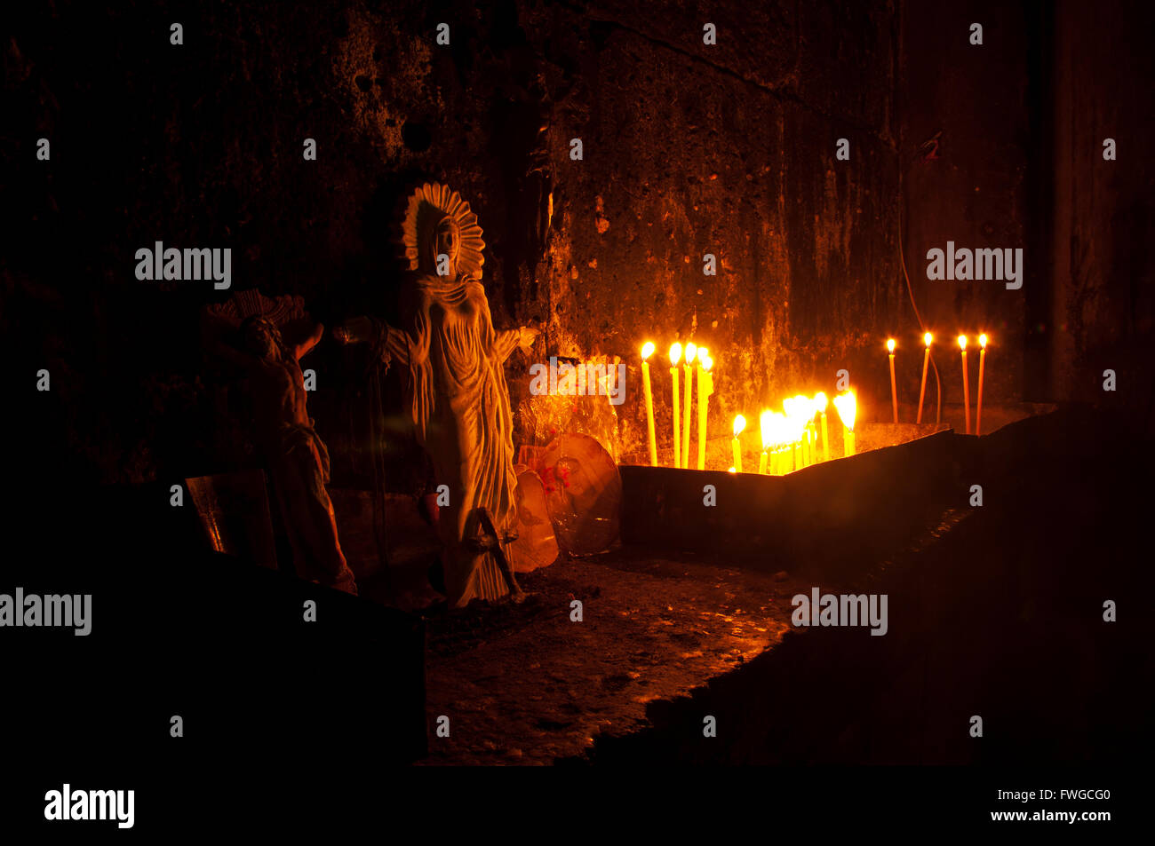 The sculptures of Jesus and Virgin Mary with candles Stock Photo Alamy