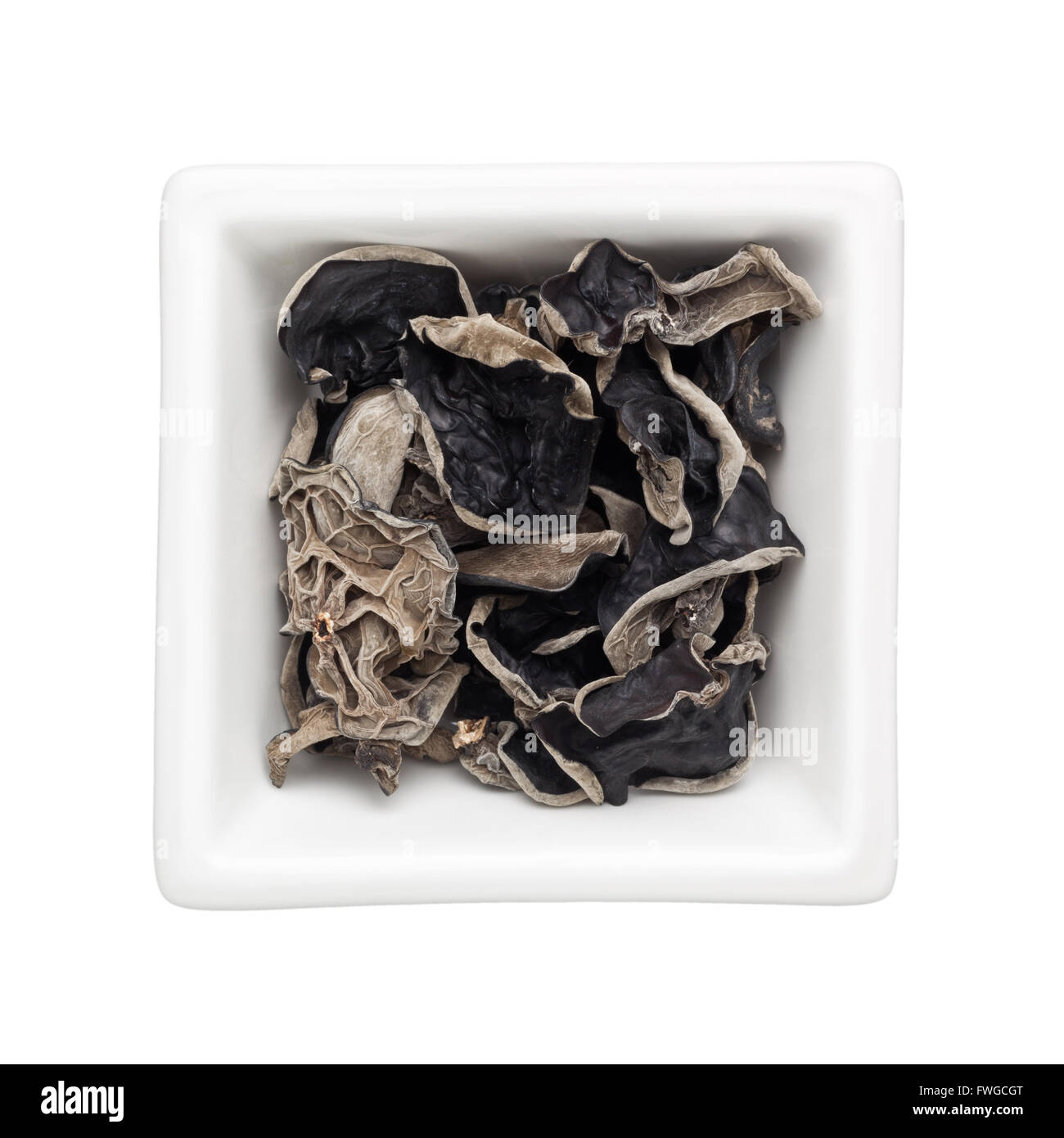 Dried black fungus in a square bowl isolated on white background Stock Photo