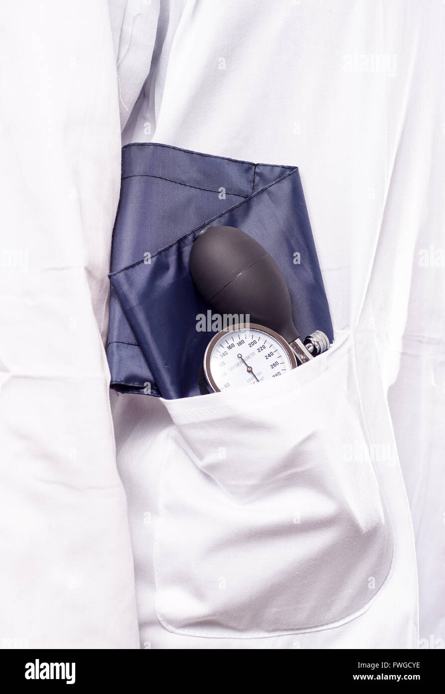 Blood pressure gauge, sphygmomanometer, in the doctora lab coat, ready
