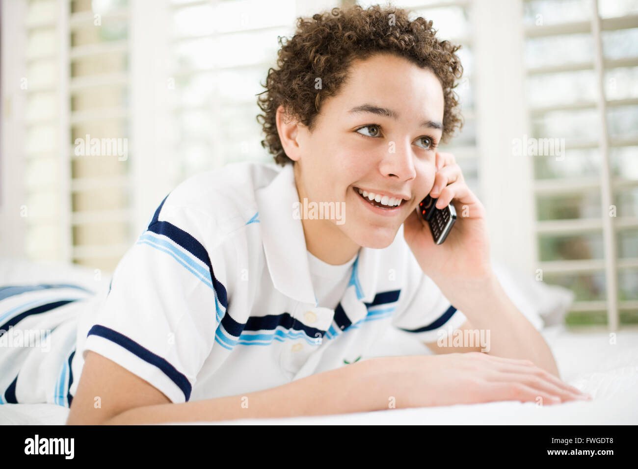 A boy talking on a mobile phone. Stock Photo