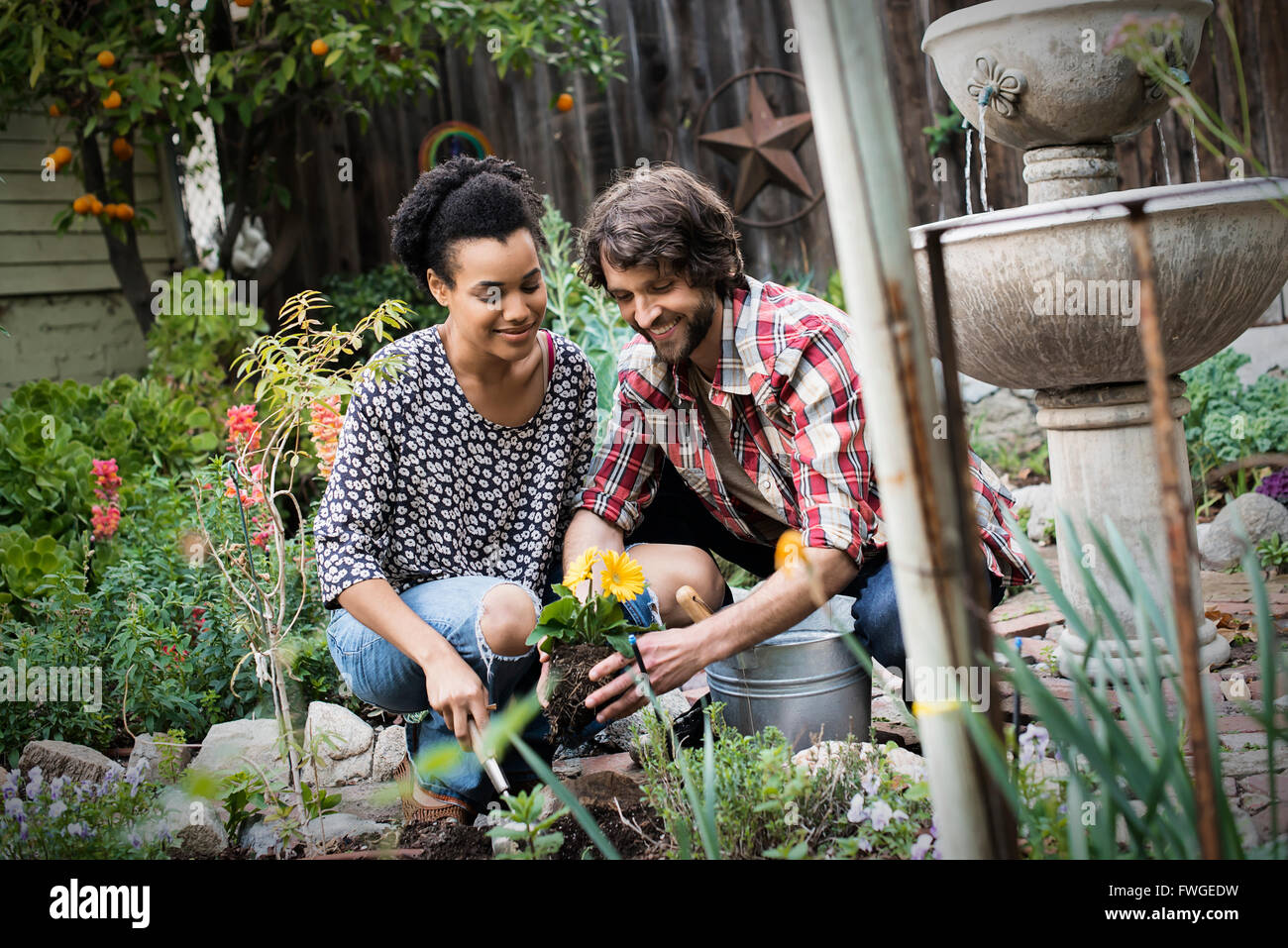 Couple in a garden hi-res stock photography and images - Alamy