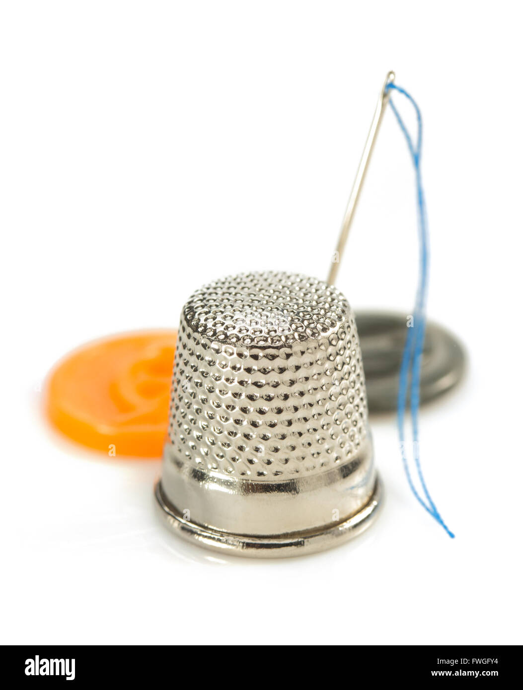 sewing thimble and thread with needle isolated on white background Stock Photo Alamy