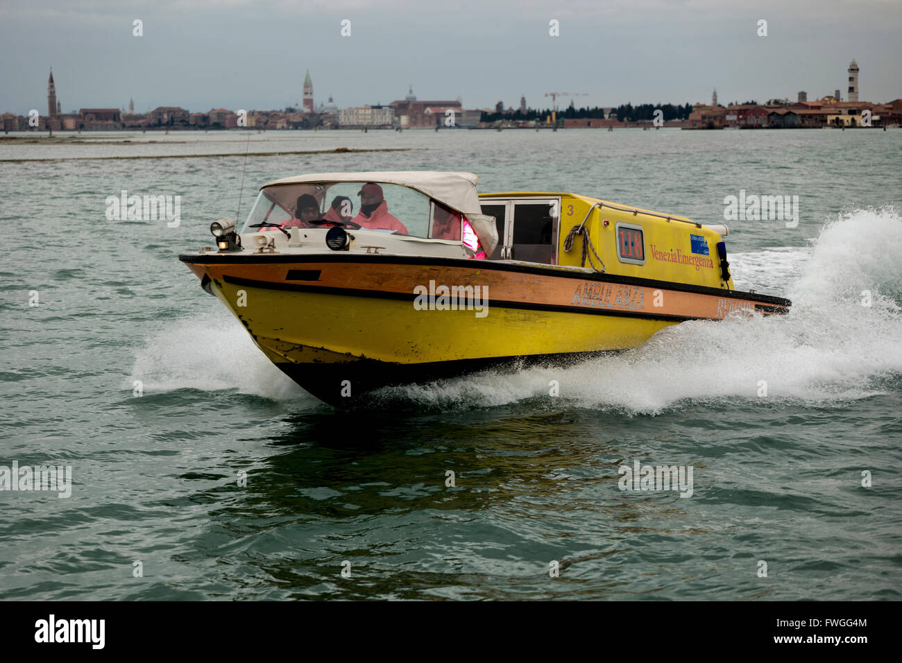 Water ambulance at speed on the Venice lagoon, Italy. Stock Photo