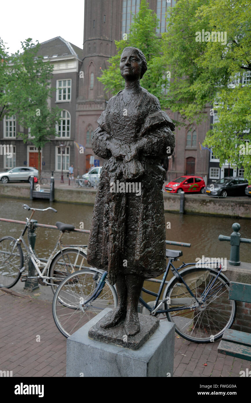 Bronze sculpture of a woman on Singel in Amsterdam, Netherlands Stock