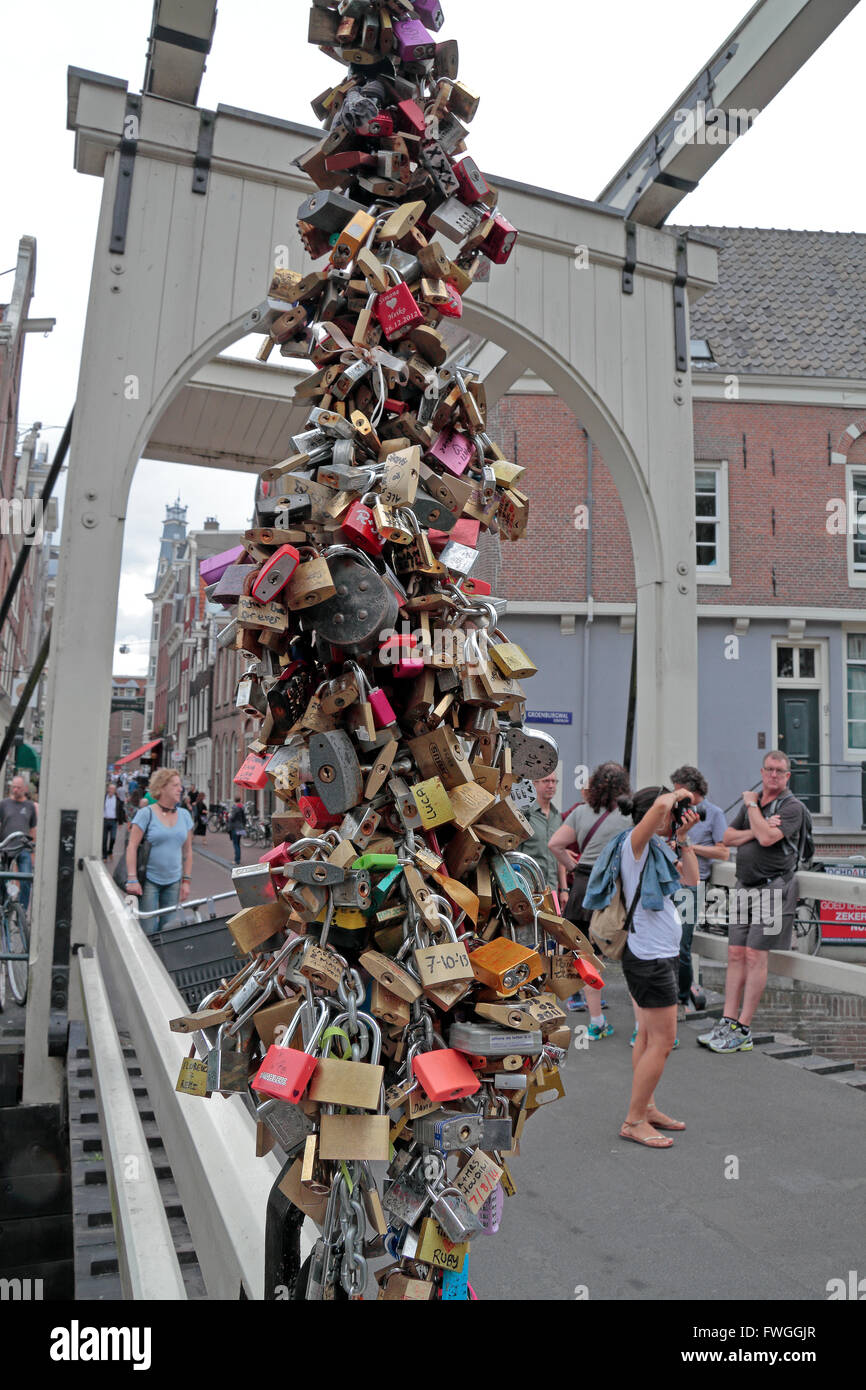 Love locks on the Staalmeestersbrug over the Groenburgwal Amsterdam, Netherlands. Stock Photo