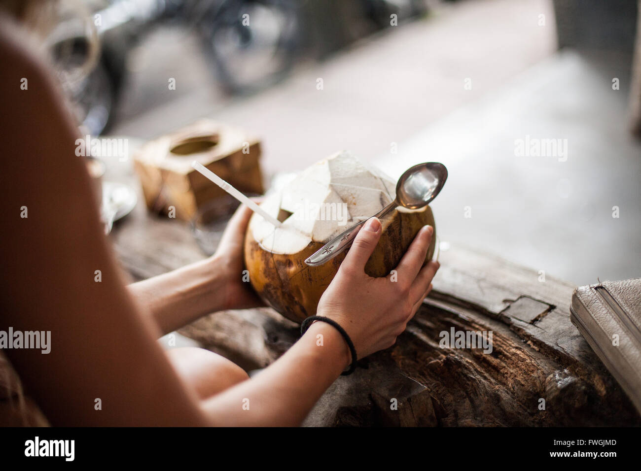 Woman Holding Coconut Drink Stock Photo