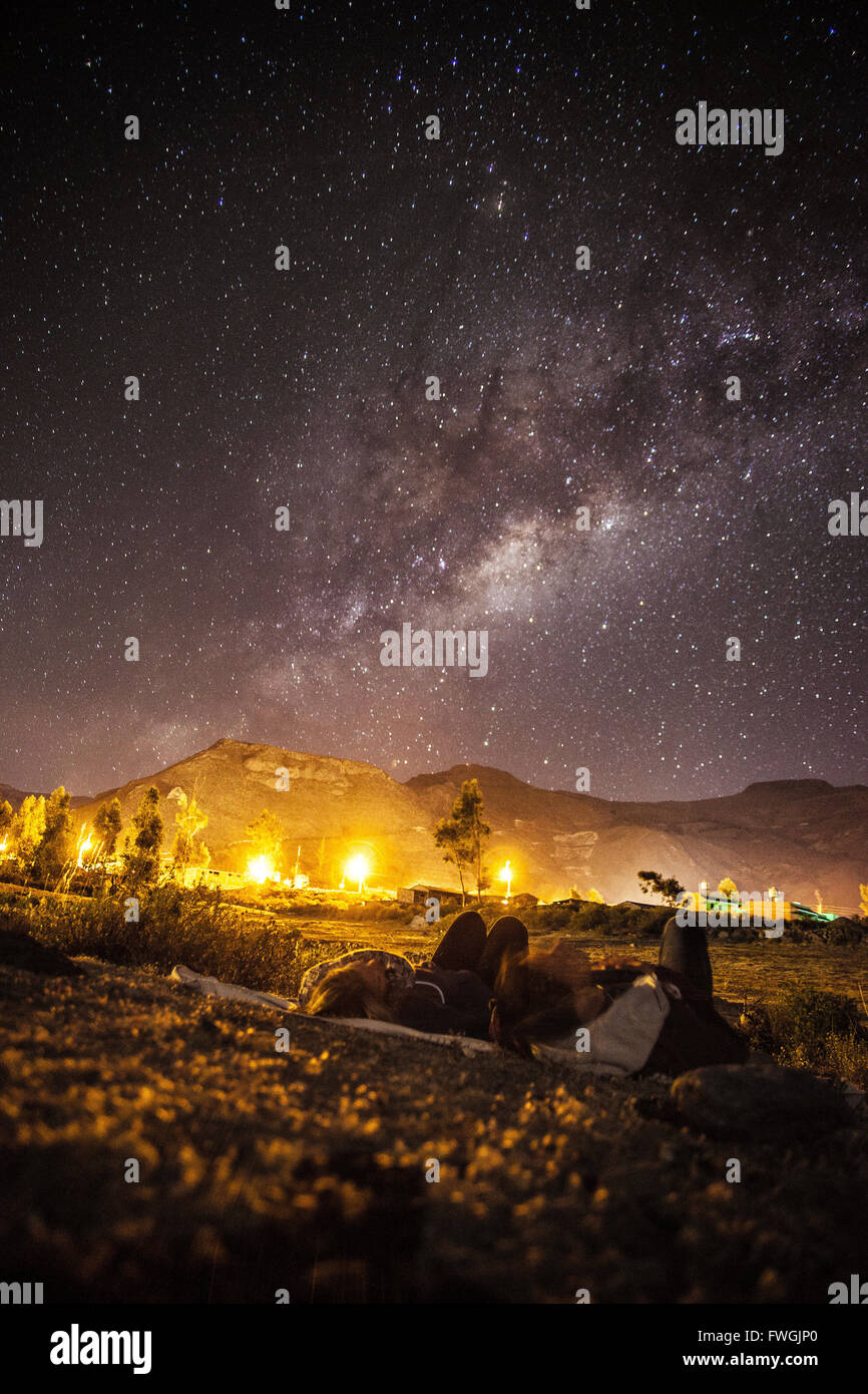 Young Couple Watching Milky Way Stock Photo