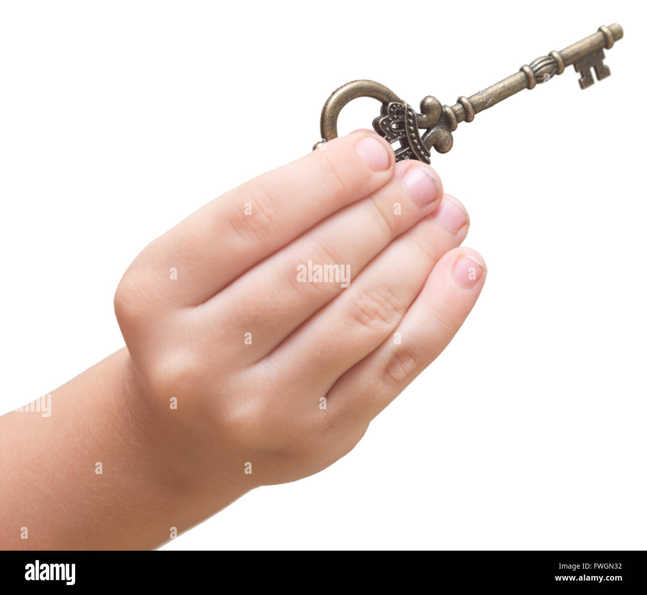 old key in a baby hands isolated on white background Stock Photo